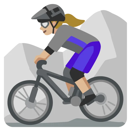The woman mountain biking: medium-light skin tone emoji.