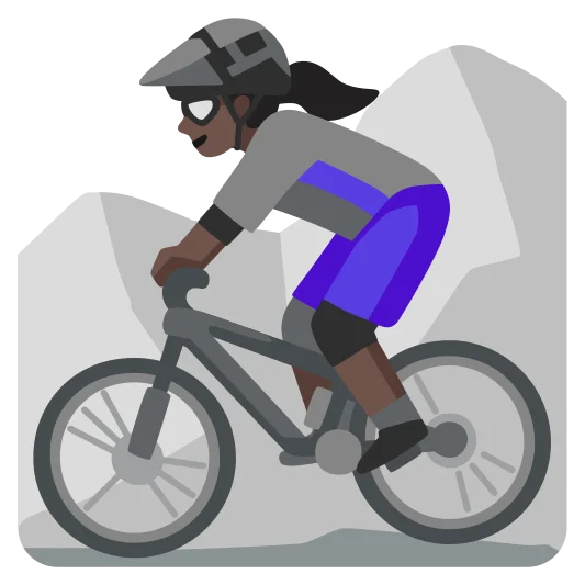 The woman mountain biking: dark skin tone emoji.